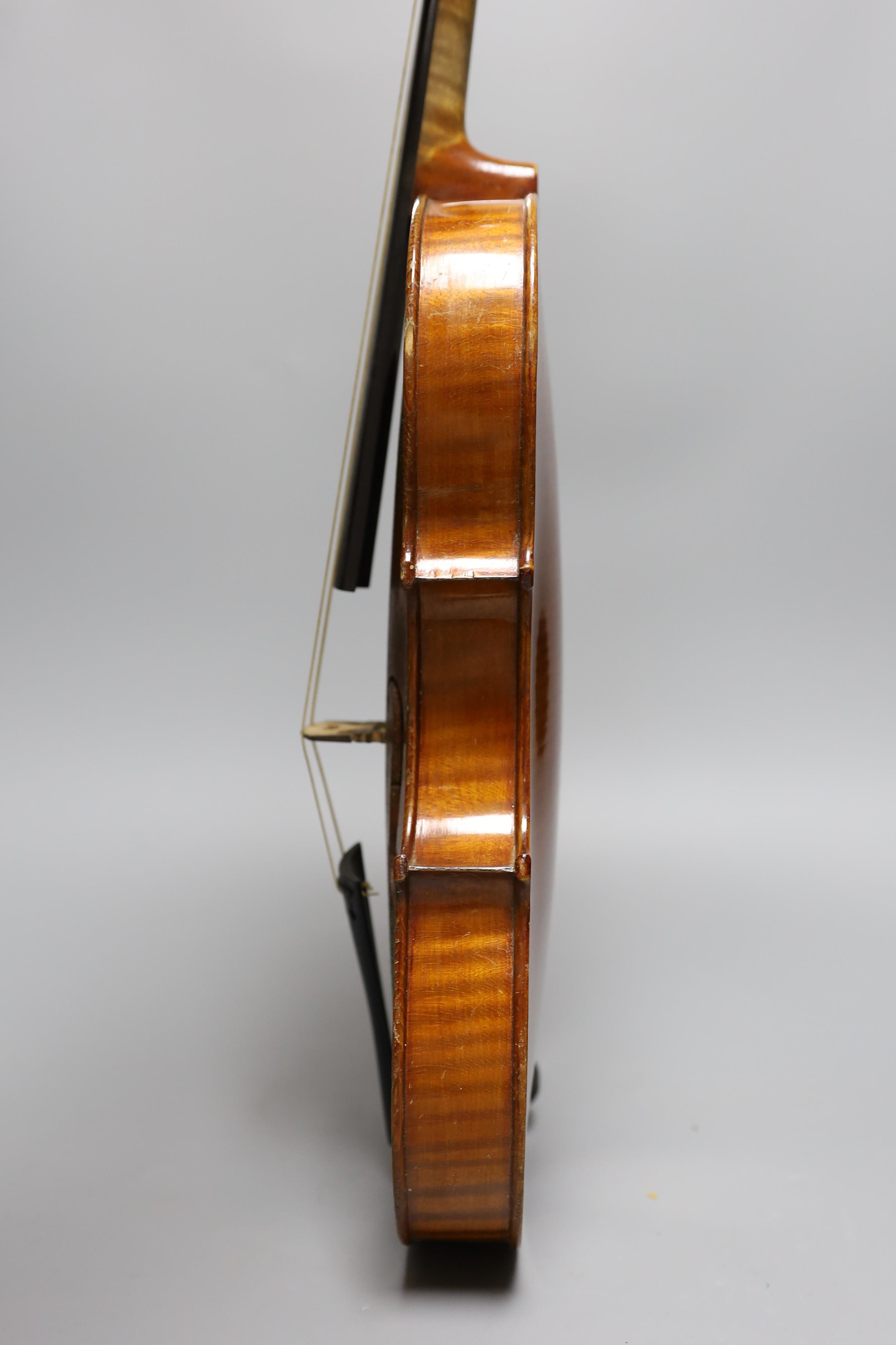 No labe and it is a full sized one.An early 20th century cased violin, length of back 36 cm